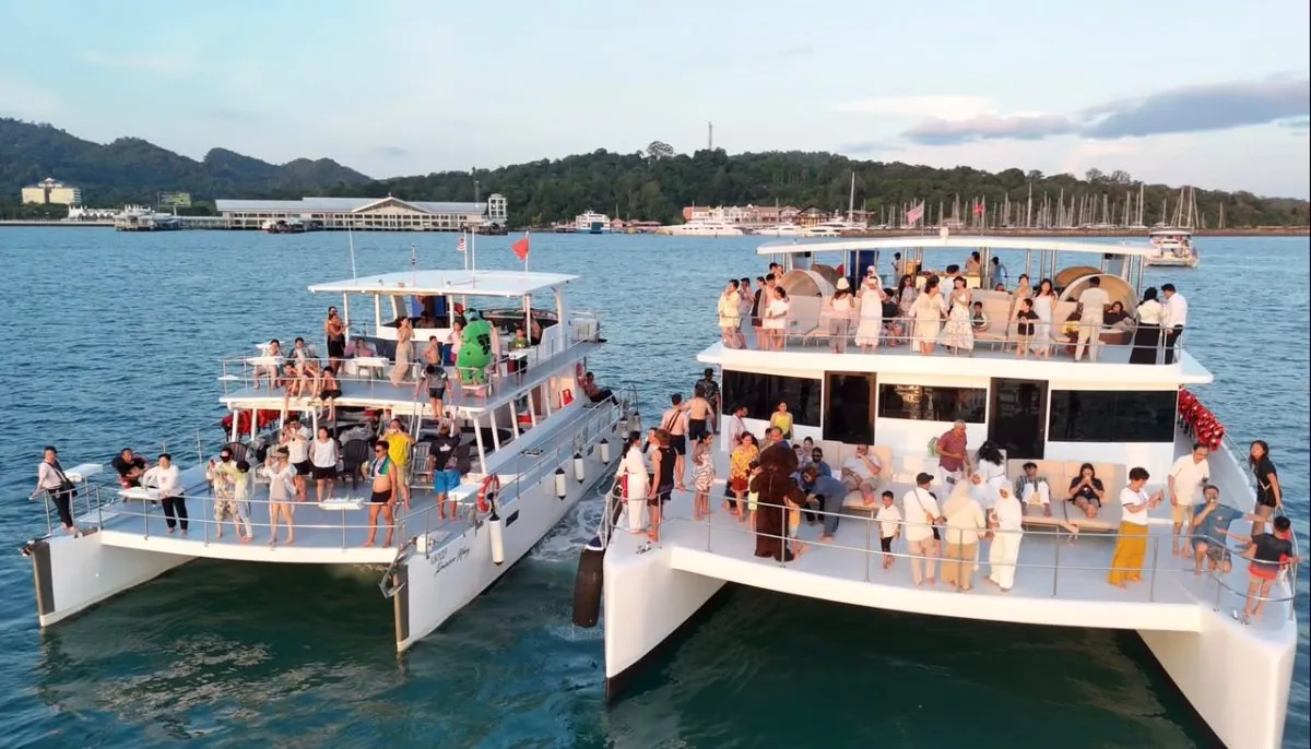 Two catamarans full of guests on a Langkawi sunset cruise