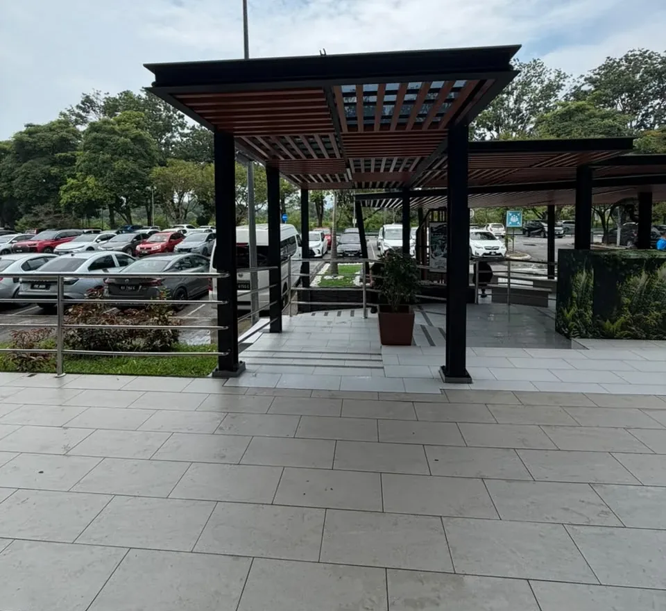 Covered walkway outside Langkawi International Airport departures, looking towards the car park
